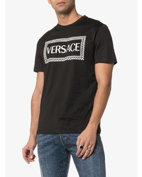 schwarzes und weißes bedrucktes T-Shirt mit einem Rundhalsausschnitt von Versace