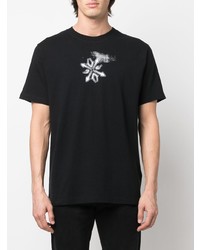 schwarzes und weißes bedrucktes T-Shirt mit einem Rundhalsausschnitt von Off-White