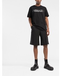 schwarzes und weißes bedrucktes T-Shirt mit einem Rundhalsausschnitt von Versace