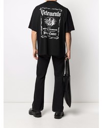 schwarzes und weißes bedrucktes T-Shirt mit einem Rundhalsausschnitt von Vetements