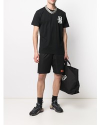 schwarzes und weißes bedrucktes T-Shirt mit einem Rundhalsausschnitt von Marcelo Burlon County of Milan