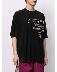 schwarzes und weißes bedrucktes T-Shirt mit einem Rundhalsausschnitt von Marcelo Burlon County of Milan