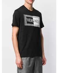 schwarzes und weißes bedrucktes T-Shirt mit einem Rundhalsausschnitt von Versace