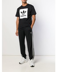 schwarzes und weißes bedrucktes T-Shirt mit einem Rundhalsausschnitt von adidas