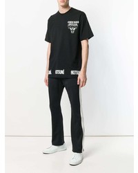 schwarzes und weißes bedrucktes T-Shirt mit einem Rundhalsausschnitt von MAISON KITSUNÉ