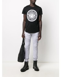 schwarzes und weißes bedrucktes T-Shirt mit einem Rundhalsausschnitt von Balmain