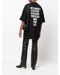 schwarzes und weißes bedrucktes T-Shirt mit einem Rundhalsausschnitt von Vetements