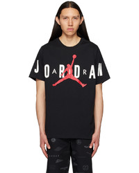 schwarzes und weißes bedrucktes T-Shirt mit einem Rundhalsausschnitt von NIKE JORDAN