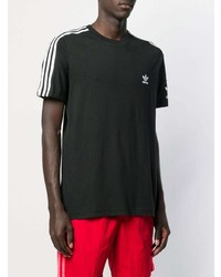 schwarzes und weißes bedrucktes T-Shirt mit einem Rundhalsausschnitt von adidas