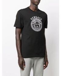 schwarzes und weißes bedrucktes T-Shirt mit einem Rundhalsausschnitt von Versace