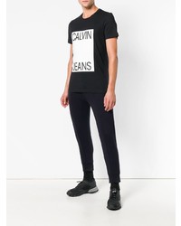 schwarzes und weißes bedrucktes T-Shirt mit einem Rundhalsausschnitt von Calvin Klein Jeans