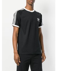 schwarzes und weißes bedrucktes T-Shirt mit einem Rundhalsausschnitt von adidas