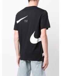 schwarzes und weißes bedrucktes T-Shirt mit einem Rundhalsausschnitt von Nike