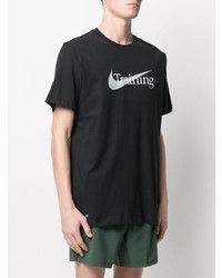 schwarzes und weißes bedrucktes T-Shirt mit einem Rundhalsausschnitt von Nike