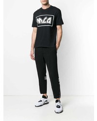 schwarzes und weißes bedrucktes T-Shirt mit einem Rundhalsausschnitt von McQ Alexander McQueen