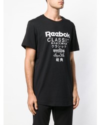 schwarzes und weißes bedrucktes T-Shirt mit einem Rundhalsausschnitt von Reebok