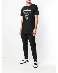 schwarzes und weißes bedrucktes T-Shirt mit einem Rundhalsausschnitt von Reebok