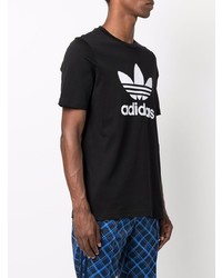 schwarzes und weißes bedrucktes T-Shirt mit einem Rundhalsausschnitt von adidas