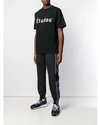 schwarzes und weißes bedrucktes T-Shirt mit einem Rundhalsausschnitt von Études