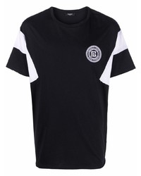 schwarzes und weißes T-Shirt mit einem Rundhalsausschnitt von Balmain