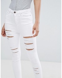 weiße enge Jeans mit Destroyed-Effekten