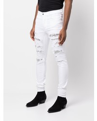 weiße enge Jeans mit Destroyed-Effekten von Amiri