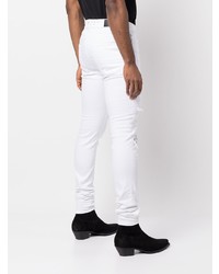 weiße enge Jeans mit Destroyed-Effekten von Amiri