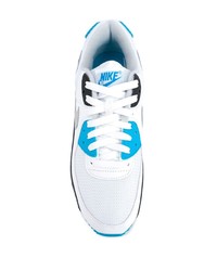 weiße und blaue Sportschuhe von Nike