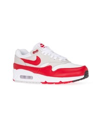weiße und rote niedrige Sneakers von Nike