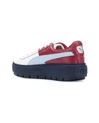 weiße und rote und dunkelblaue niedrige Sneakers von Puma