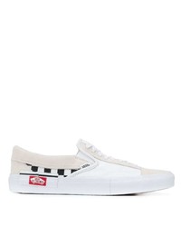 weiße und schwarze Slip-On Sneakers aus Segeltuch von Vans