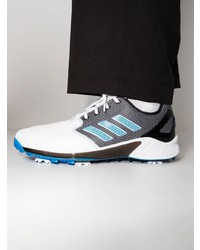 weiße und schwarze Sportschuhe von ADIDAS GOLF