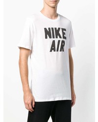 weißes und schwarzes bedrucktes T-Shirt mit einem Rundhalsausschnitt von Nike