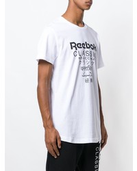 weißes und schwarzes bedrucktes T-Shirt mit einem Rundhalsausschnitt von Reebok