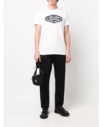 weißes und schwarzes bedrucktes T-Shirt mit einem Rundhalsausschnitt von Diesel