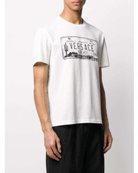 weißes und schwarzes bedrucktes T-Shirt mit einem Rundhalsausschnitt von Versace