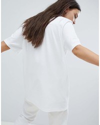 weißes und schwarzes bedrucktes T-Shirt mit einem Rundhalsausschnitt von Converse