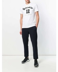 weißes und schwarzes besticktes T-Shirt mit einem Rundhalsausschnitt von Versace